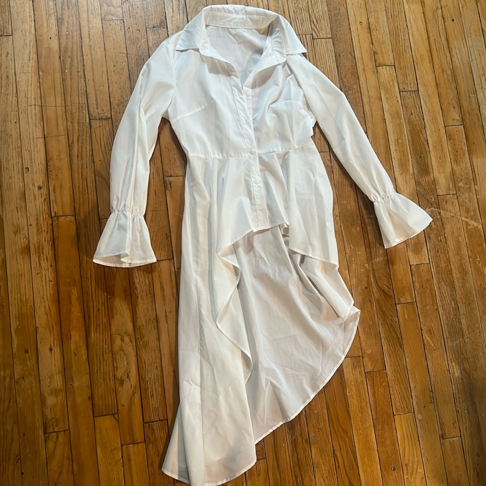 White a-symmetrical dress shirt with flounce hem and ruffled sleeve cuff